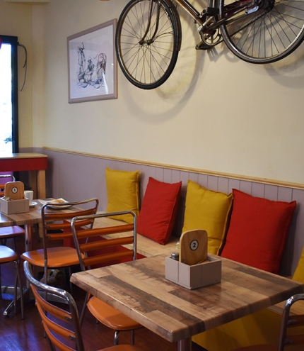 Pushbike on wall and seating inside Little Hoi An Vietnamese Restaurant