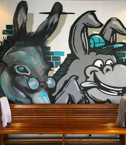 Mural of two donkeys on the wall at Two Donkeys Spring Hill