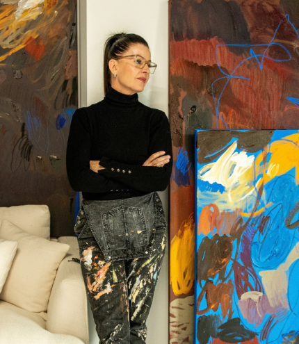 women standing in front of artwork 
