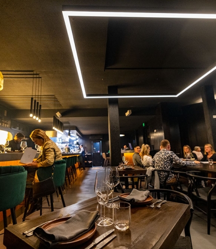 Dimly-lit interior of The Arsonist Manly