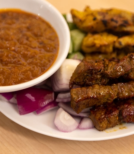 Satay sticks on plate at Mamak CBD