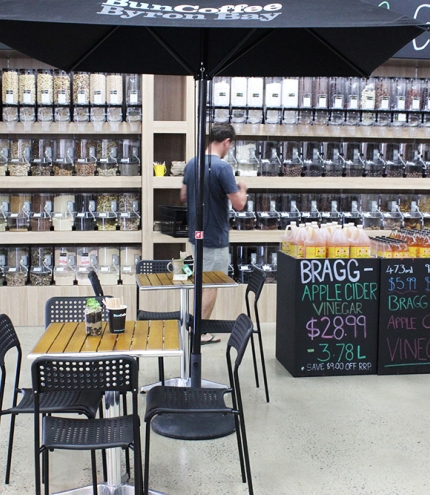 Person selecting bulk foods at Kiah Organic Wholefoods Warehouse Mt Gravatt