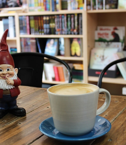 Gnome and coffee cup on table at Little Gnome Wynnum