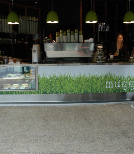 Man buying cup of coffee at counter of Mugged Espresso Bar in Bulimba