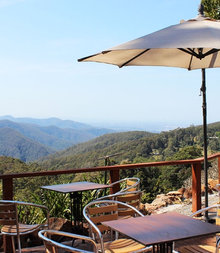 Seating on verandah overlooking Guanaba Gorge at St Bernards Hotel Mt Tamborine