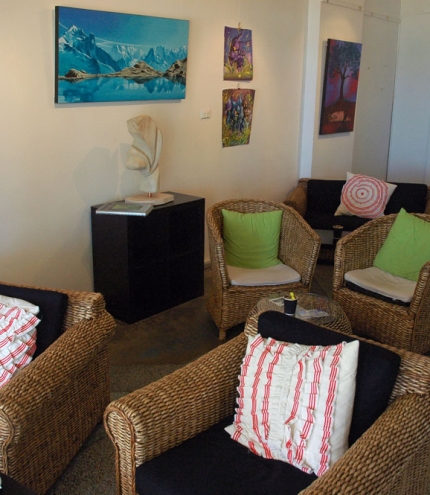 Seating and paintings and sculptures inside Valori espresso Lounge