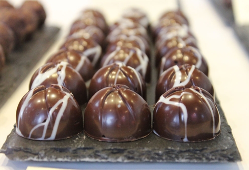 Three rows of little chocolates inside 31 Degrees Custom Chocolates Woolloongabba