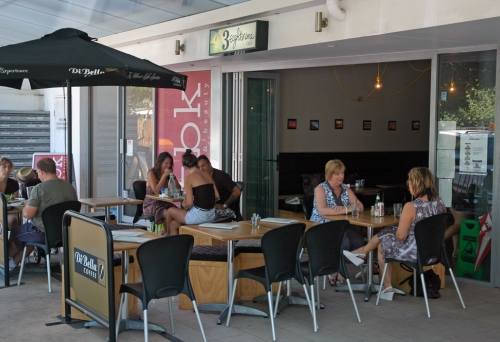 People dining outside 3Eightnine cafe, Scarborough
