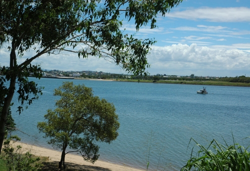 Sandy beach overlooking bush and the Brisbane River in Colmslie Beach Reserve Murarrie