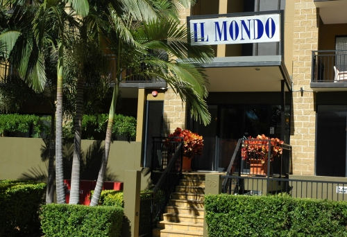 Entrance and sign on building of Il Mondo Boutique Hotel Kangaroo Point