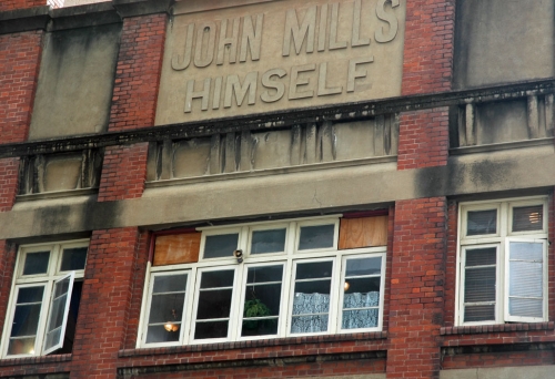 john Mills Himself sign on building in Brisbane's Charlotte street.