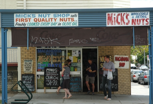 People standing outside Mick’s Nuts in West End.