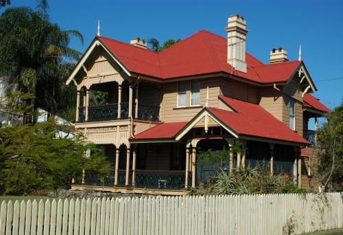 Nassagaweya house behind picket fence on Gray Rd in West End