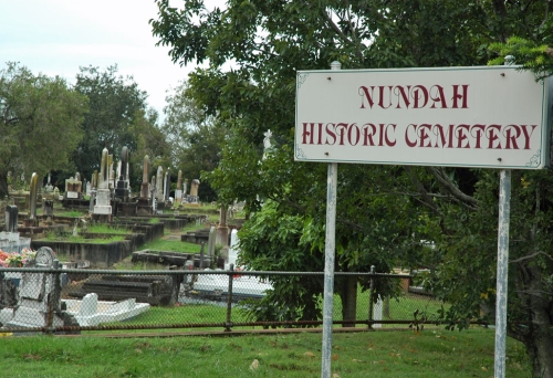 Entrance to Nundah Historic Cemetery with tomb stones in the background