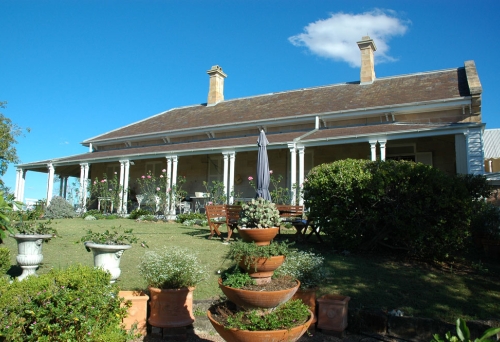 Oakwal House and garden with bird bath in Bush St Windsor