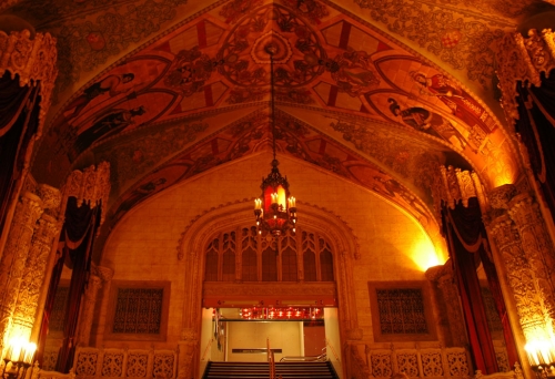Inside the Regent Theatre Brisbane with paintings on walls