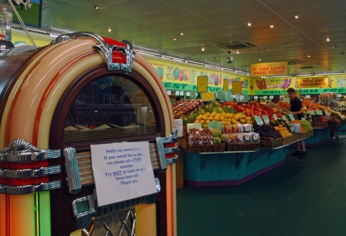junk box and fruit and vegetable aisles inside Rock’n’Roll Marketplace Greenslopes