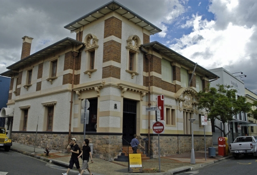 Pedestrians walking in front of Woolloongabba Post Office