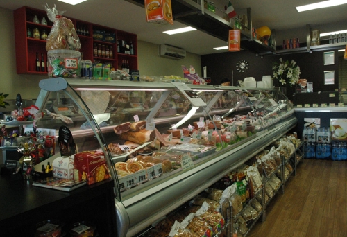 Deli counter with small goods inside Amici Deli in Chermside.