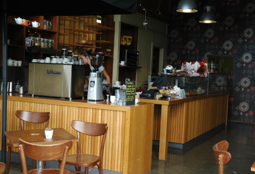 Counter with breads and cakes inside Banneton Bakery Café in Woolloongabba