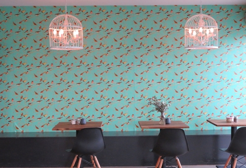 Tables and chairs inside Birds And Bees Cafe Everton Hills