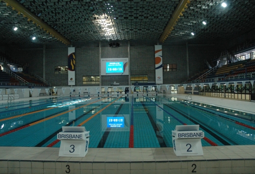 indoor lap pool and lanes with giant tv screen 
