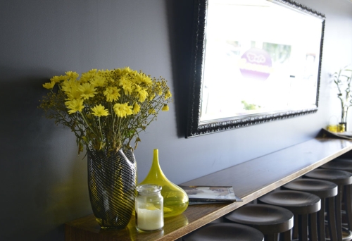 Fresh flowers sitting on bench inside Cafe Lacuna in  Wavell Heights Brisbane.