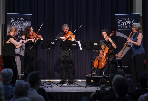 ARCO Orchestra performing on stage 