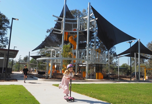 Child playing in playground, Archerfield Wetlands District Park