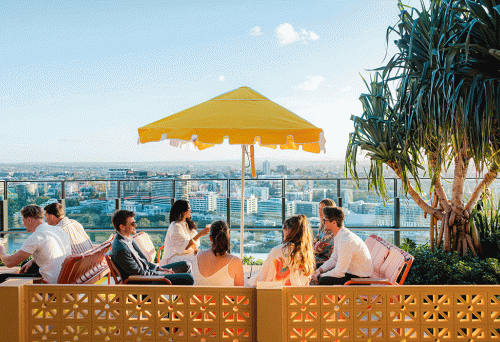 People under umbrella looking at view Sky Deck