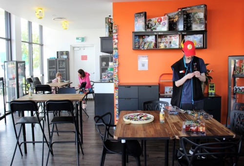 Staff standing next to table inside Coffee n Bricks, Wynnum 