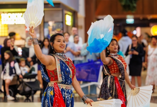 two ladies do a traditional dance