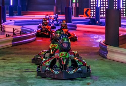 kids in go-karts at Game Over