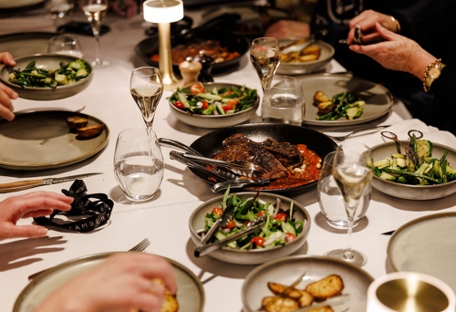 Diners at a table inside Lamberts Restaurant