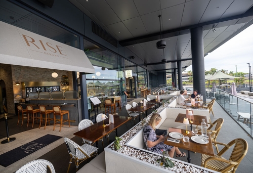 People seated on terrace at Rise Le Restaurant 