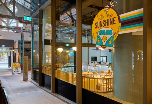 Front window with signage at Little Miss Sunshine Brisbane CBD