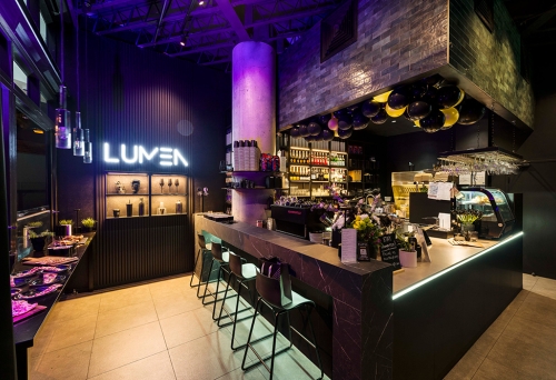 Bar with green stools inside Lumen Cafe Lounge Toowong