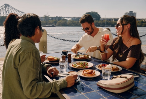 People having brunch by the river
