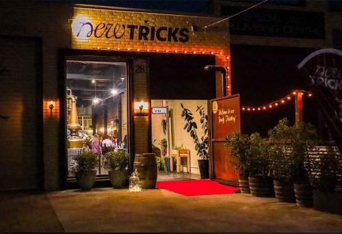 Exterior entry to New Tricks Albion by night
