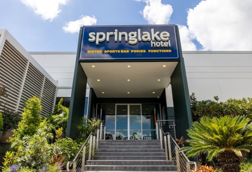 Exterior entrance to the Springlake Hotel with concrete stairs
