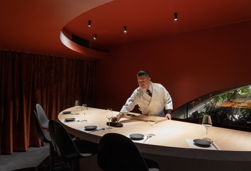 Staff member setting table at Sushi Room Fortitude Valley