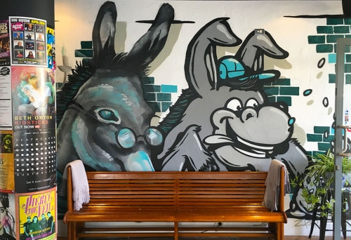 Mural of two donkeys on the wall at Two Donkeys Spring Hill