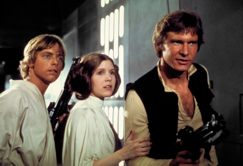 Three people standing in sci-fi movie 