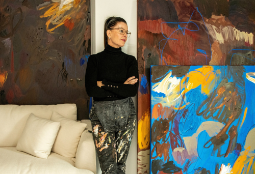women standing in front of artwork 