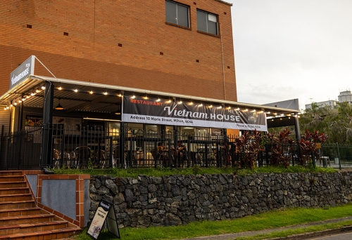Exterior of Vietnam House Milton showing outside seating