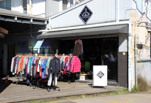Exterior of Vintage Street, Stones Corner with racks of clothing outside