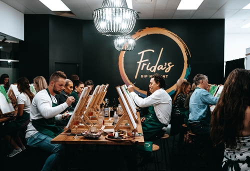 People drinking and painting at Frida's Sip n Paint