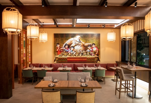 Interior seating with mural on back wall at Jumbo Thai Brisbane CBD