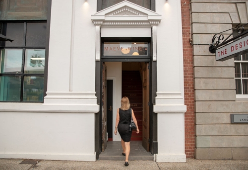 Woman walking into Maeve Wine Bar, South Brisbane