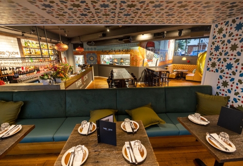 Inside tables and bar at Tarbouche Mezze Bar West End